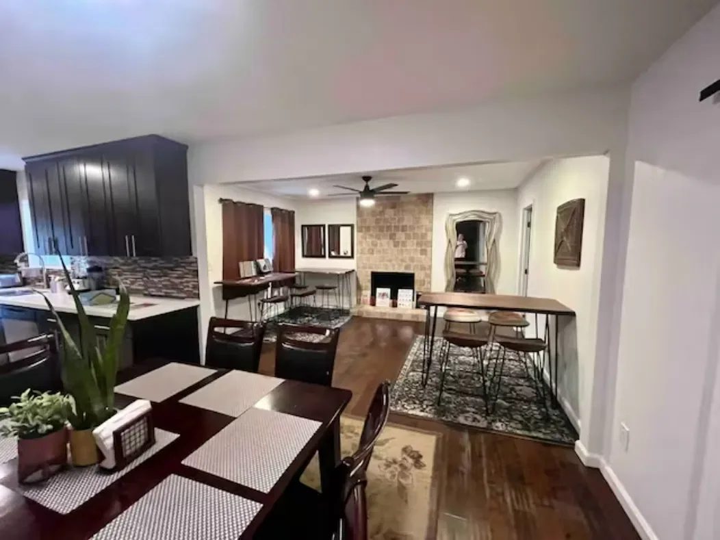 A bright, modern communal living room designed for social connection and group meetings in a supportive environment.
